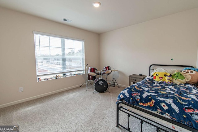 bedroom featuring carpet flooring, visible vents, and baseboards