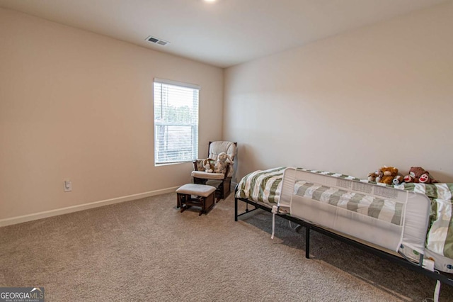 carpeted bedroom with baseboards and visible vents