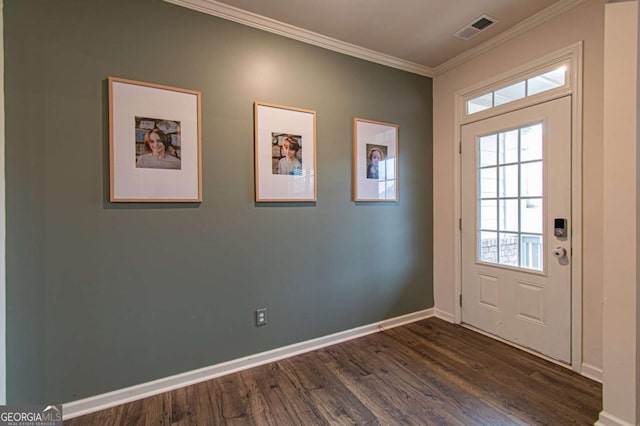 doorway to outside with baseboards, visible vents, dark wood-style flooring, and crown molding