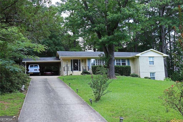 view of front facade featuring driveway, brick siding, a front lawn, and an attached carport