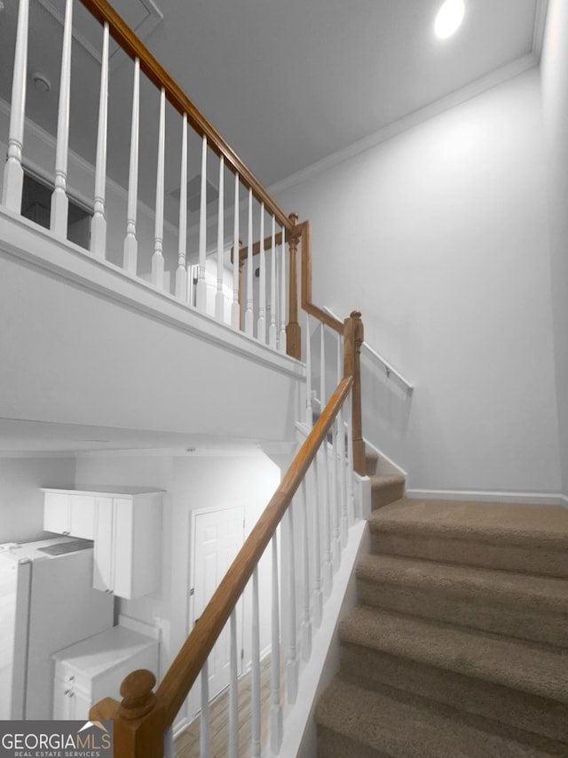 stairway featuring recessed lighting, baseboards, and crown molding