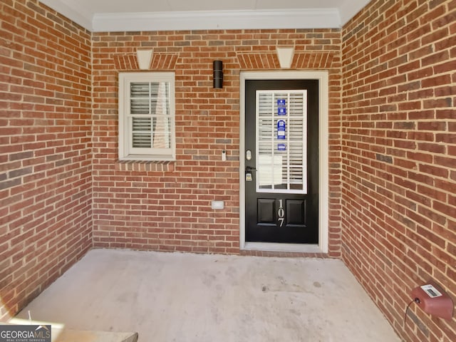 entrance to property with brick siding