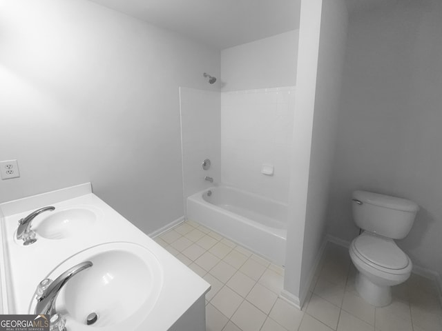 full bathroom featuring tile patterned floors, toilet, shower / bathtub combination, and a sink