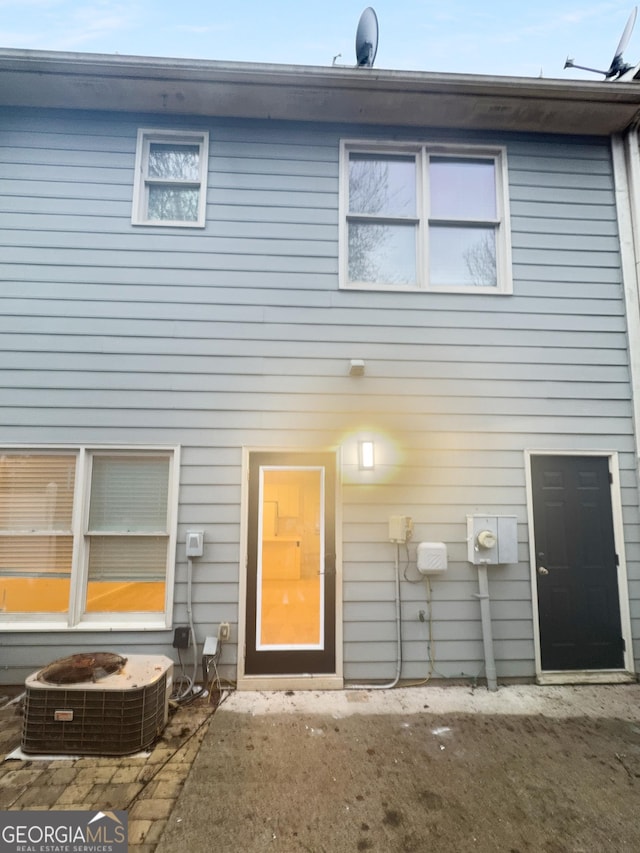 view of front of home featuring central air condition unit