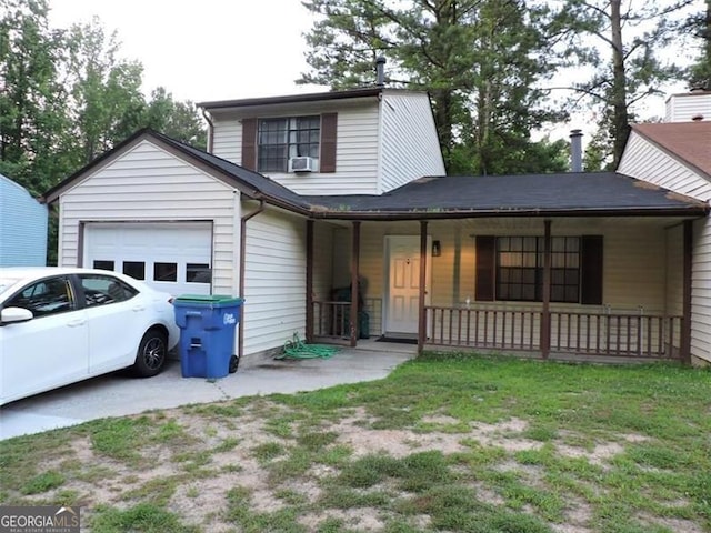 view of front of house featuring cooling unit, covered porch, driveway, and an attached garage