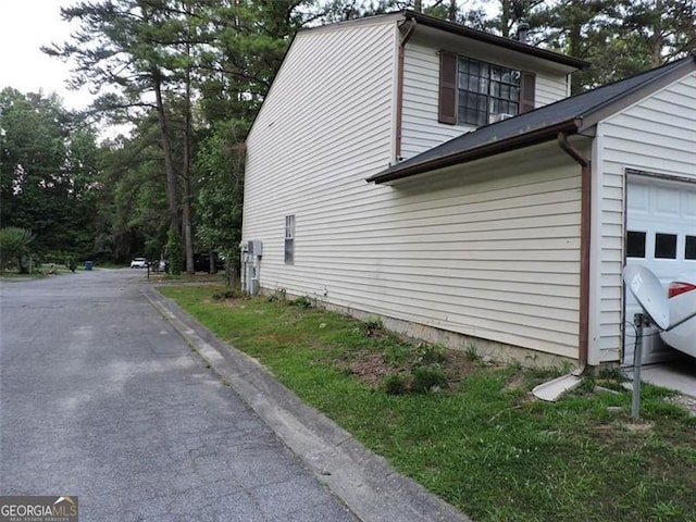 view of property exterior featuring a garage