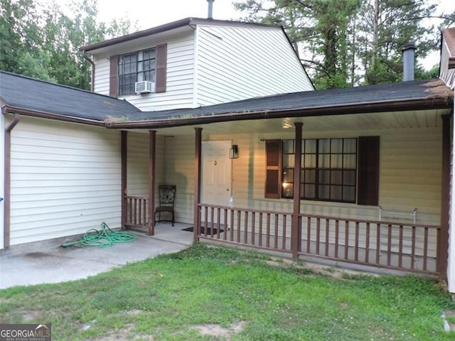 exterior space with a porch and a front lawn