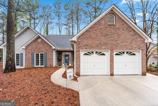 view of front of home with driveway, brick siding, an attached garage, and a shingled roof