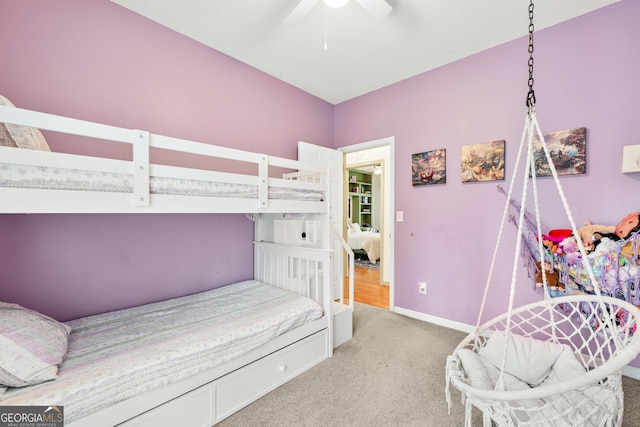 bedroom with baseboards, light carpet, and a ceiling fan