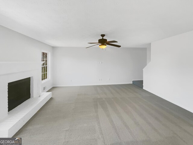 1110 Robert Pointe Way, Lawrenceville, GA 30045 - unfurnished living room featuring carpet floors, a fireplace, and a ceiling fan