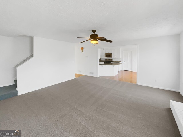 1110 Robert Pointe Way, Lawrenceville, GA 30045 - unfurnished living room featuring light carpet and a ceiling fan