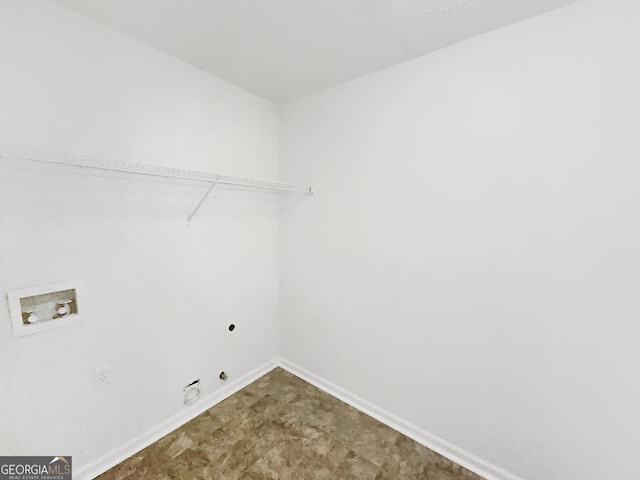 laundry area with baseboards, hookup for an electric dryer, laundry area, washer hookup, and hookup for a gas dryer