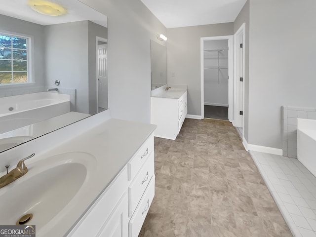 1110 Robert Pointe Way, Lawrenceville, GA 30045 - full bathroom featuring two vanities, a bath, and a spacious closet