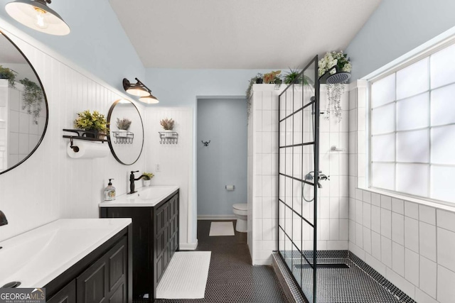 full bath featuring walk in shower, tile patterned flooring, a sink, and toilet