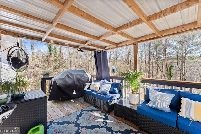 deck featuring a grill and an outdoor living space