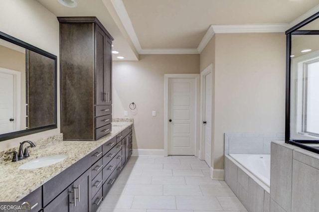 full bath featuring a garden tub, double vanity, a sink, and crown molding