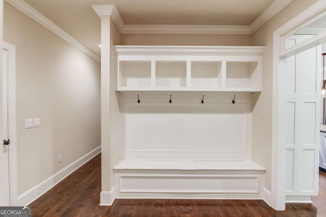 mudroom featuring crown molding, wood finished floors, and baseboards