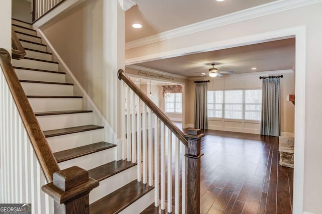 staircase featuring ceiling fan, ornamental molding, wood finished floors, and recessed lighting