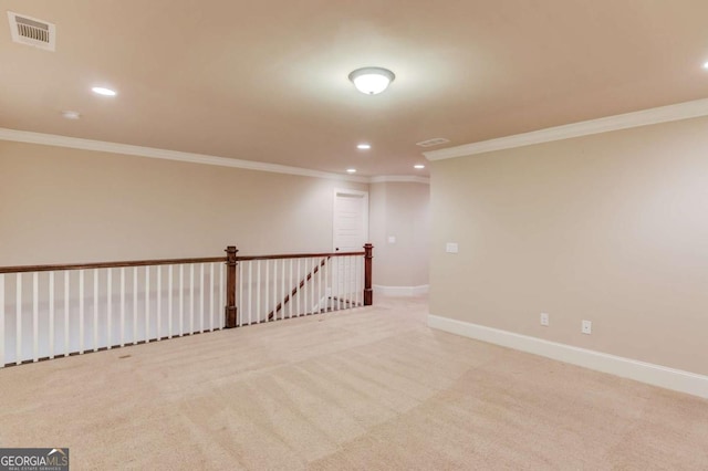 carpeted spare room featuring recessed lighting, visible vents, and baseboards