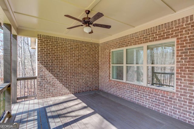 wooden terrace featuring ceiling fan