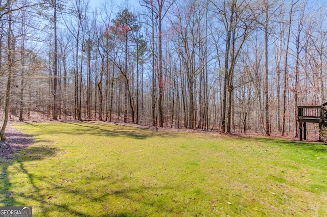 view of yard with a forest view