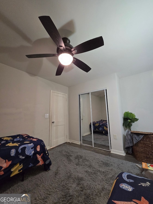 2077 Brockett Rd, Tucker, GA 30084 - bedroom with a closet, ceiling fan, and baseboards