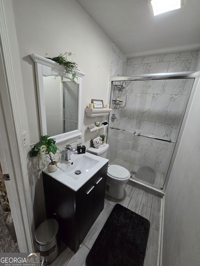 2077 Brockett Rd, Tucker, GA 30084 - bathroom with toilet, vanity, and a shower stall