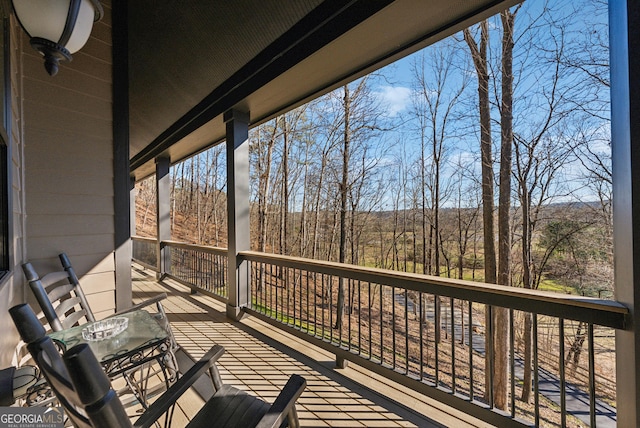 wooden deck featuring a wooded view