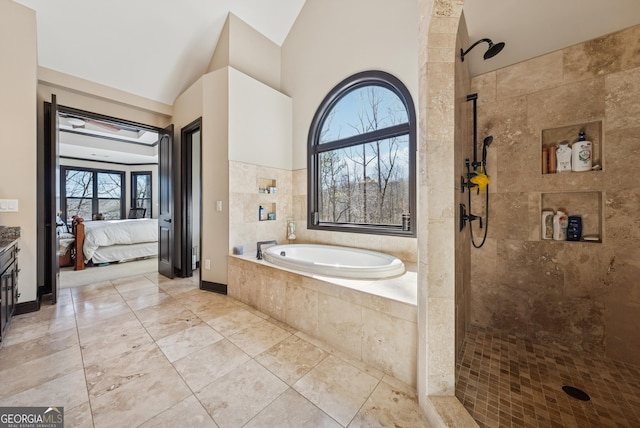 full bathroom featuring ensuite bath, vaulted ceiling, a tile shower, vanity, and a bath