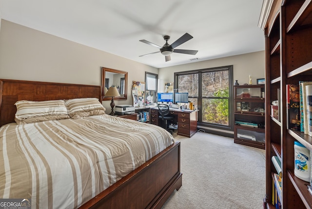 bedroom with a ceiling fan, carpet, and visible vents