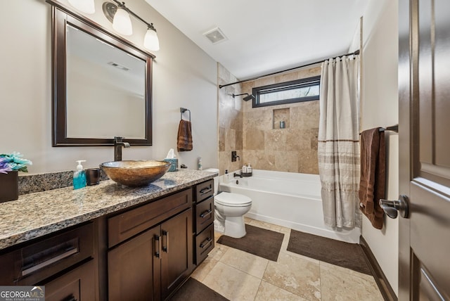 bathroom with toilet, vanity, shower / bath combination with curtain, and visible vents