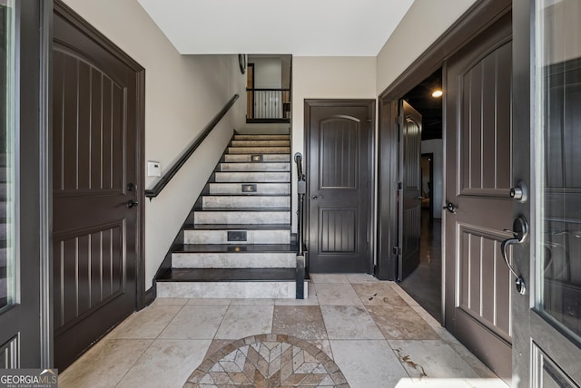 foyer entrance featuring stairs