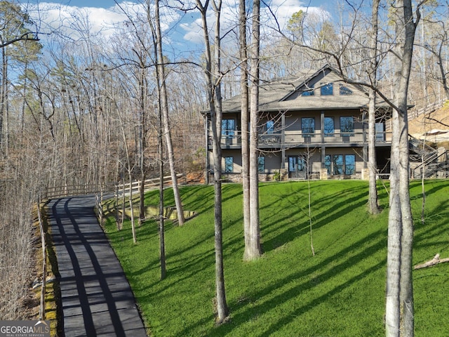 back of house featuring a yard