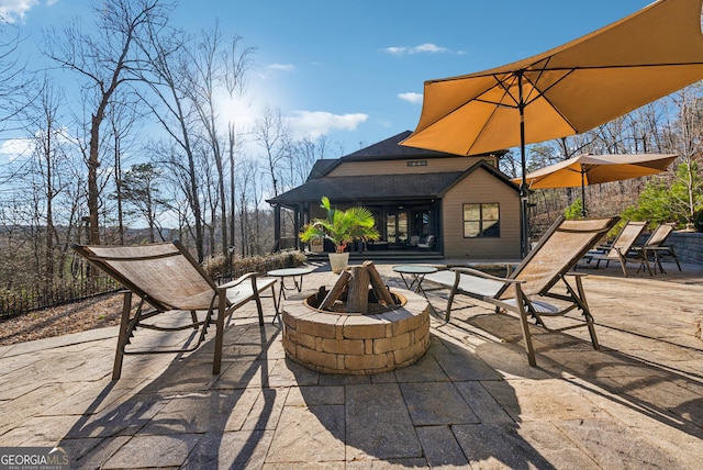 view of patio / terrace featuring a fire pit