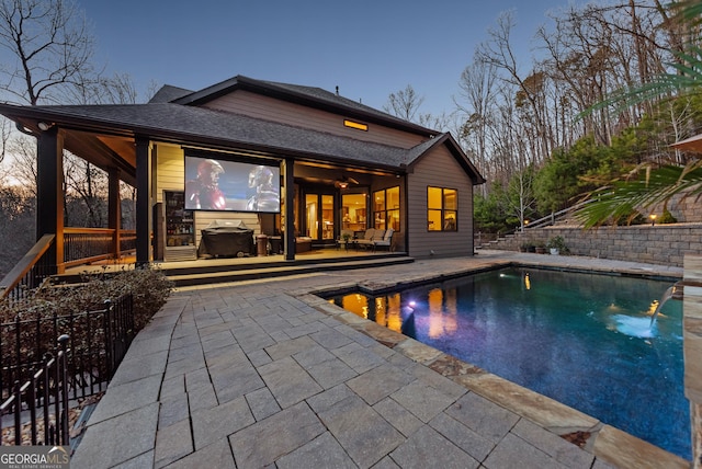 view of swimming pool featuring a fenced in pool, a patio area, and fence