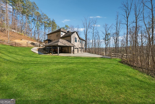 view of yard featuring fence and a gazebo