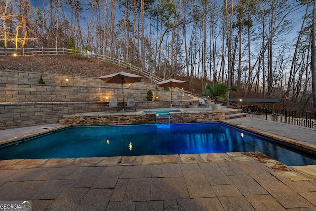 view of pool featuring an in ground hot tub, a patio, fence, and a fenced in pool