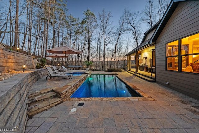 view of swimming pool with a fenced in pool, a patio, and fence