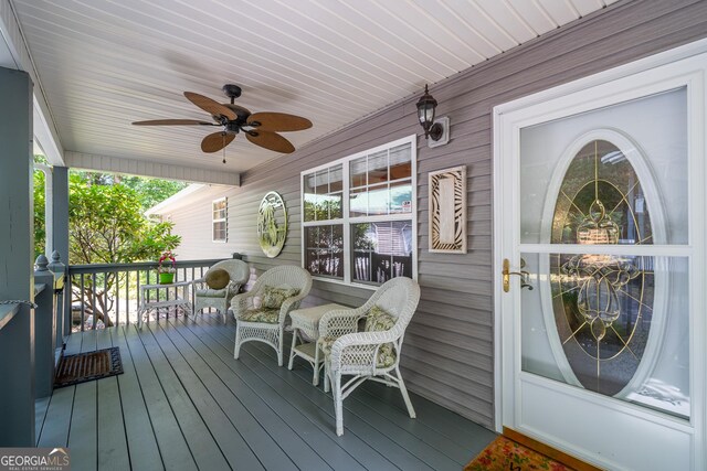 deck featuring a porch and ceiling fan