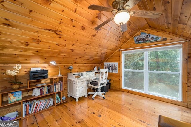 office area featuring wooden walls, light wood-style flooring, wooden ceiling, and lofted ceiling