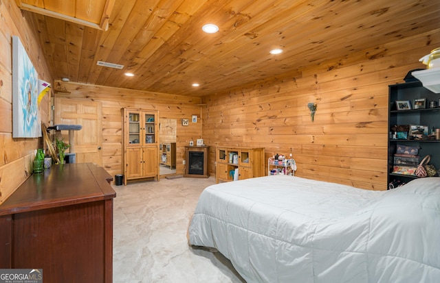 bedroom with wooden walls, visible vents, a fireplace, recessed lighting, and wood ceiling