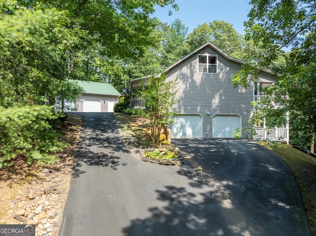 view of front of house featuring an outbuilding and a garage