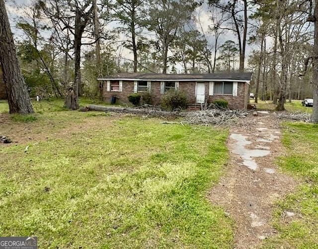 ranch-style house with a front yard