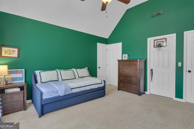 bedroom featuring visible vents, high vaulted ceiling, carpet, baseboards, and ceiling fan