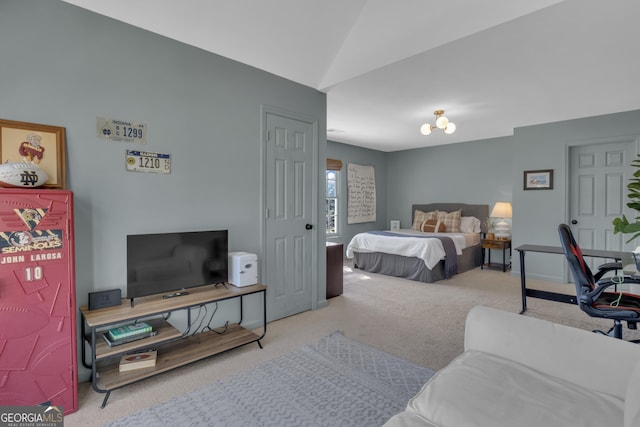 carpeted bedroom with vaulted ceiling