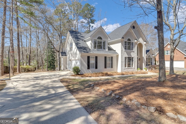 view of front of home featuring roof with shingles