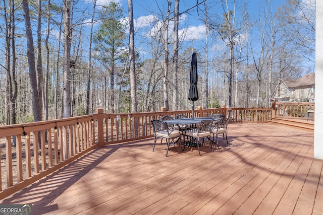 deck featuring outdoor dining area