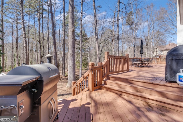 wooden deck with outdoor dining area