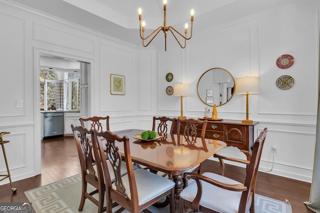 dining area with a decorative wall and dark wood-style flooring