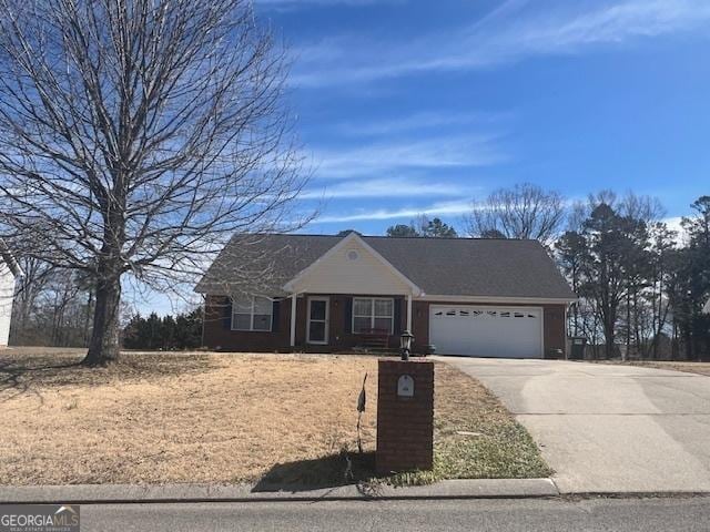 view of front of home featuring a garage and driveway